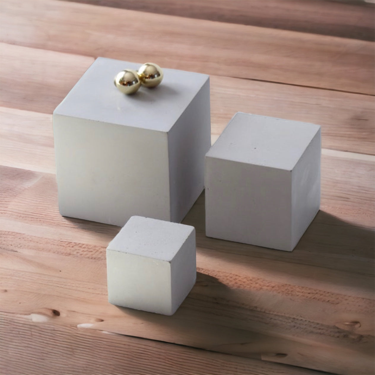 Three gray concrete cubes