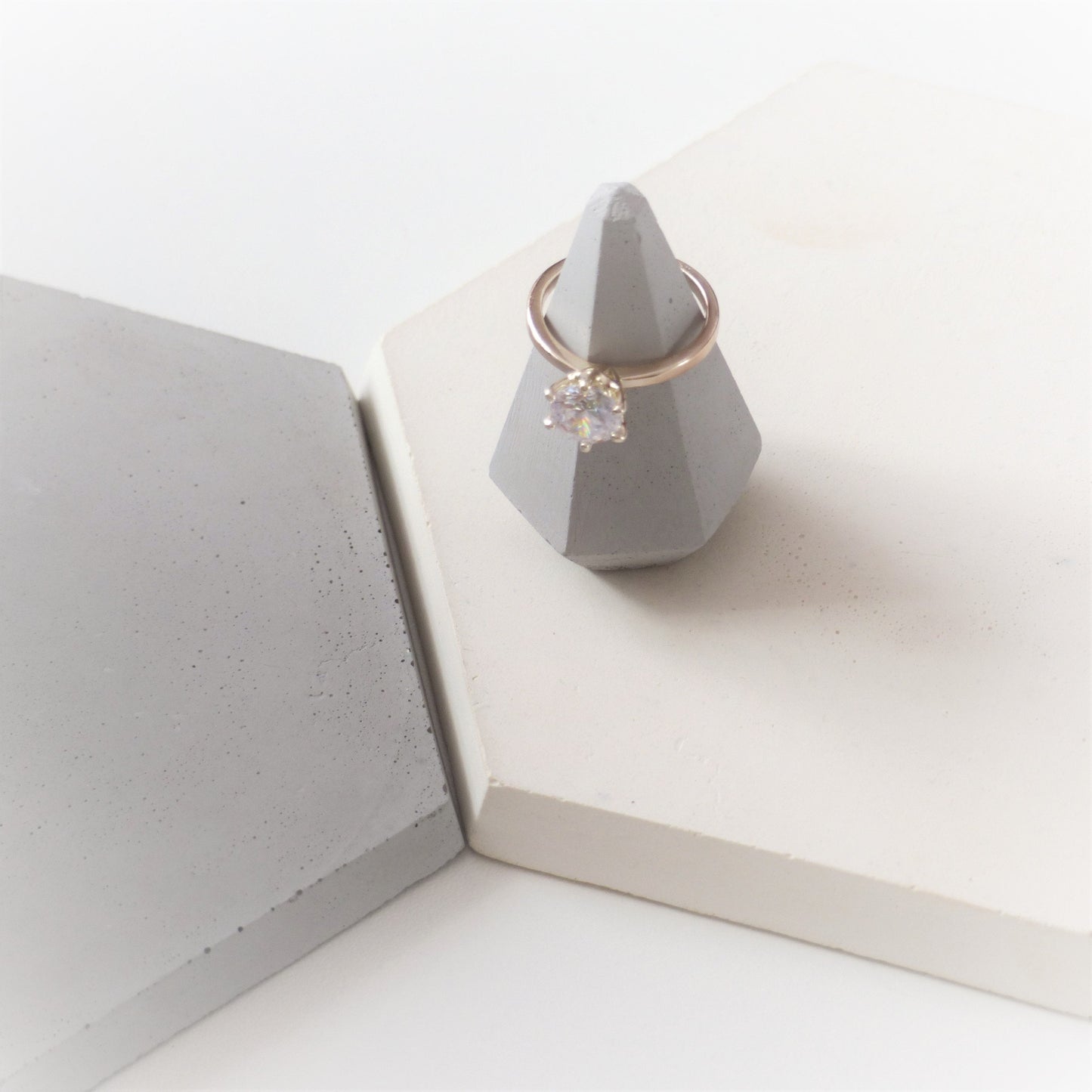 Gray ring holder in the shape of a diamond